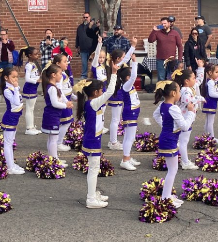 These local cheerleaders put on a show during the raising of the Christmas tree.